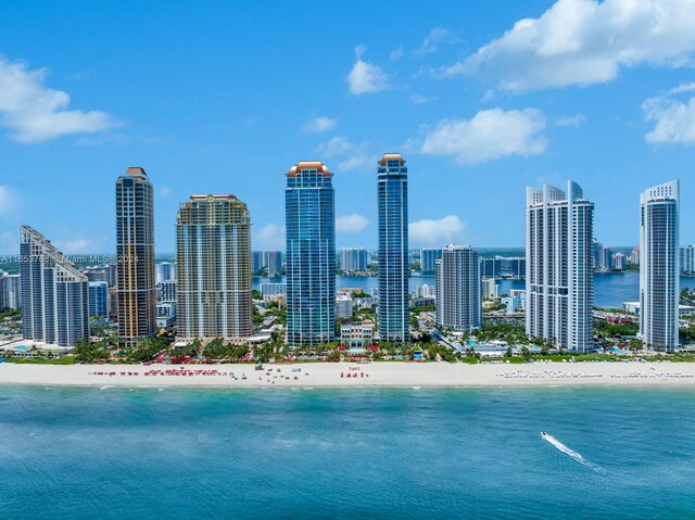 exterior space featuring a beach view and a water view