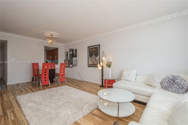 living room with crown molding and hardwood / wood-style flooring