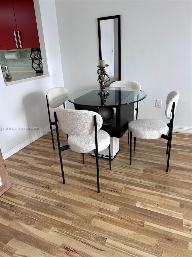 dining space featuring light hardwood / wood-style flooring