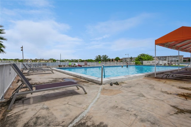 view of pool featuring a patio