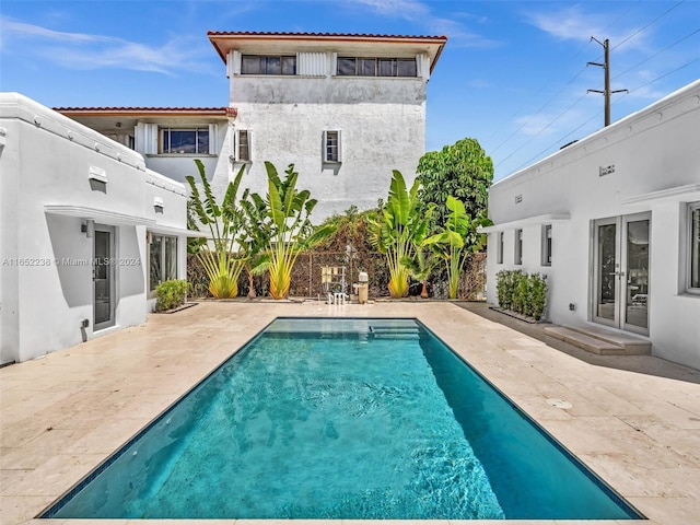 rear view of property featuring a patio area