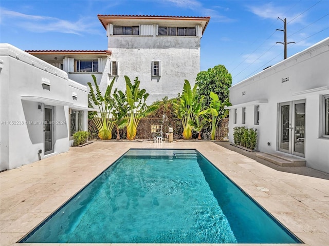 8109 Harding Ave, Miami Beach, FL 33141 - rear view of property featuring french doors, stucco siding, and a patio area