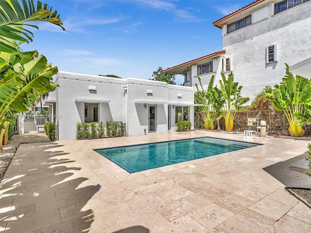 view of pool featuring a patio