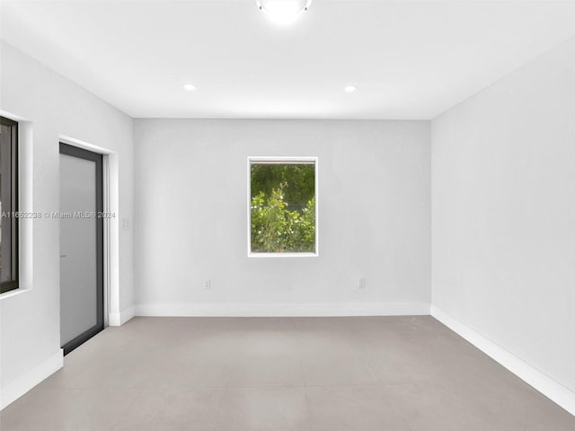 8109 Harding Ave, Miami Beach, FL 33141 - unfurnished room with baseboards and recessed lighting