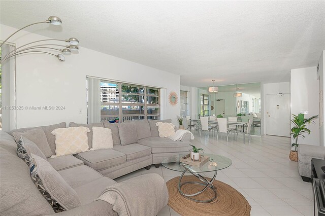 tiled living room with a textured ceiling