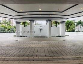 view of property's community featuring ornate columns