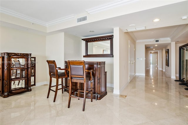 bar featuring crown molding