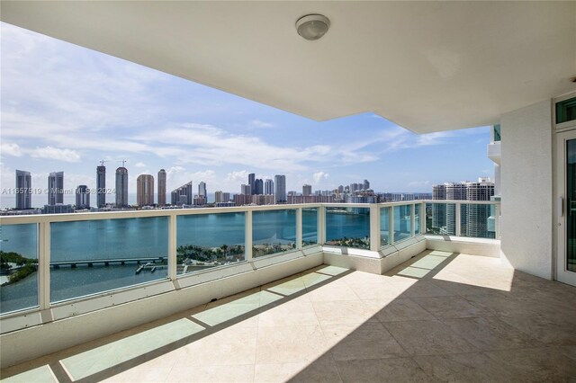 balcony featuring a water view