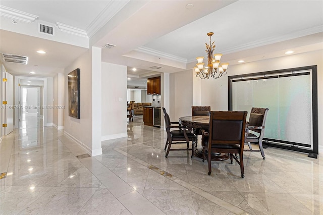 dining room with ornamental molding and a notable chandelier