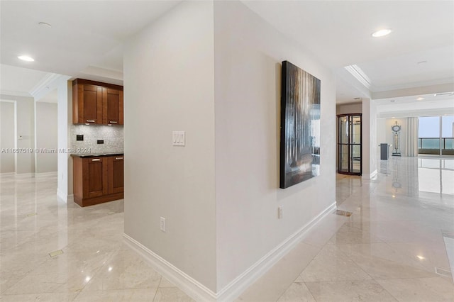 hallway with ornamental molding