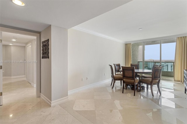 dining area featuring crown molding