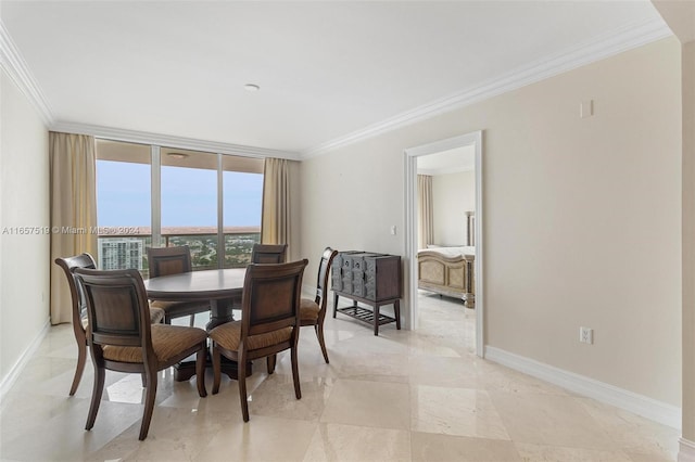 dining space with crown molding