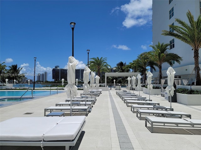 surrounding community featuring a patio and a pool