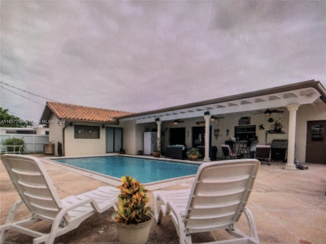 view of swimming pool featuring a patio area