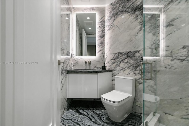 bathroom with walk in shower, tile walls, vanity, and toilet