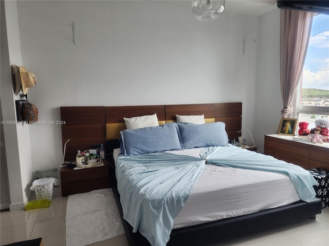 bedroom featuring light tile patterned flooring