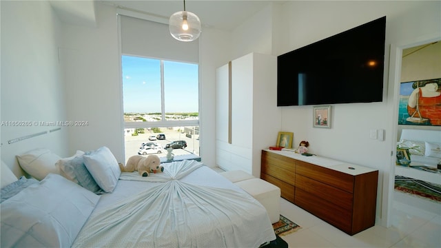 bedroom with light tile patterned floors