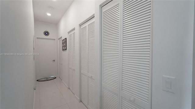 hallway featuring light tile patterned floors