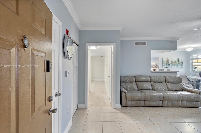 living room featuring light tile patterned flooring and ornamental molding