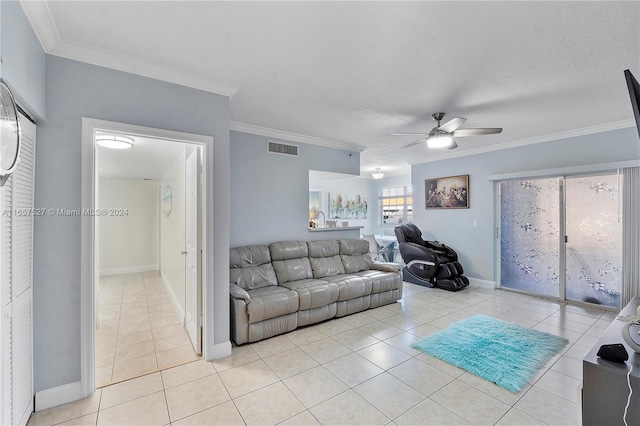 living room with ceiling fan, light tile patterned flooring, and crown molding