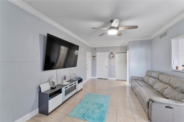 living room featuring a textured ceiling, ceiling fan, ornamental molding, and light tile patterned flooring