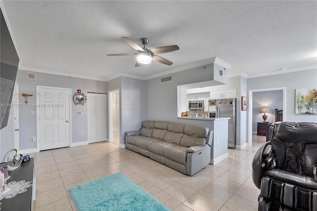 living room featuring a textured ceiling, crown molding, and light tile patterned flooring