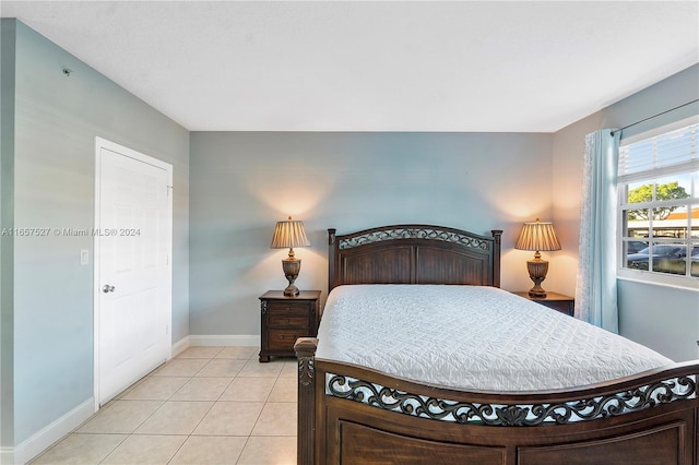 bedroom with light tile patterned flooring