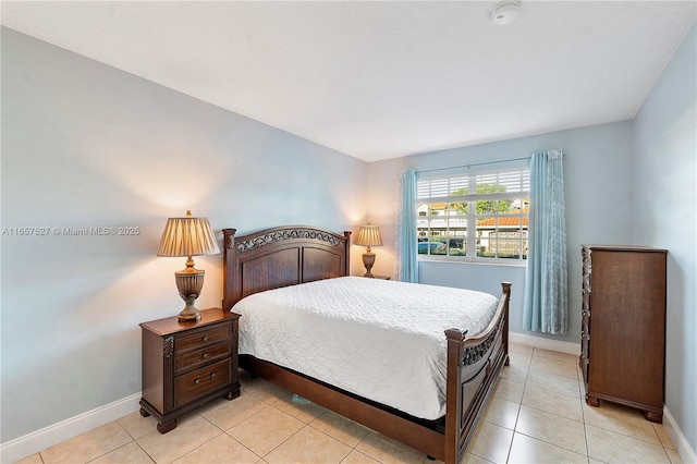 131 SW 117th Ave Unit 8103, Pembroke Pines, FL 33025 - bedroom featuring baseboards and light tile patterned floors