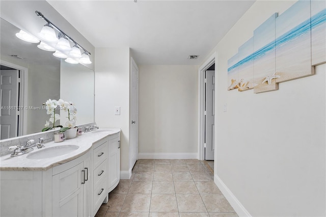 bathroom featuring tile patterned flooring and vanity