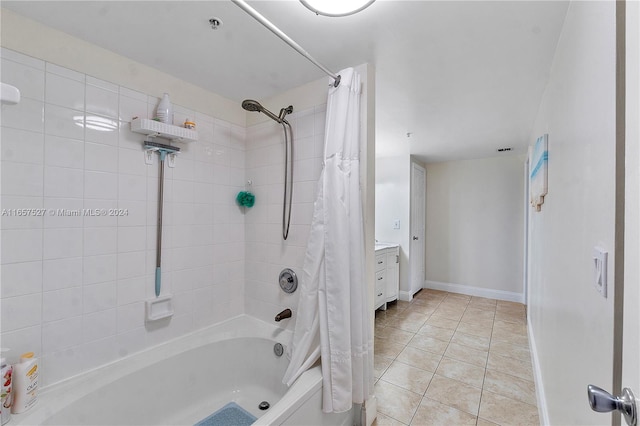 bathroom featuring tile patterned floors, vanity, and shower / bath combination with curtain