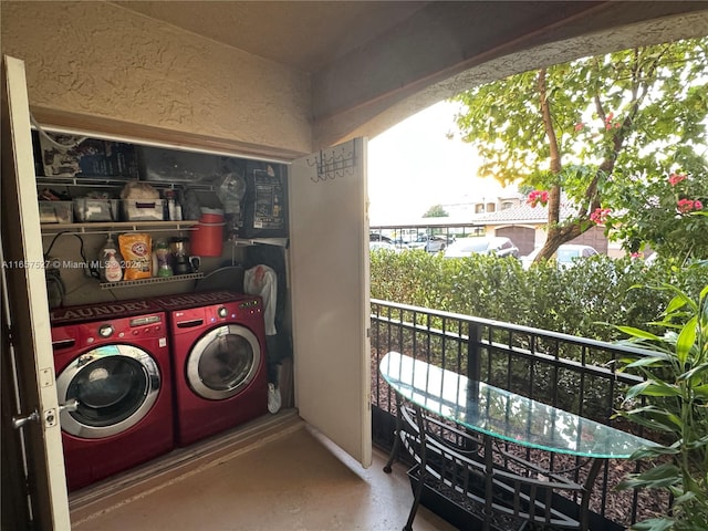 laundry area with washer and dryer and a healthy amount of sunlight