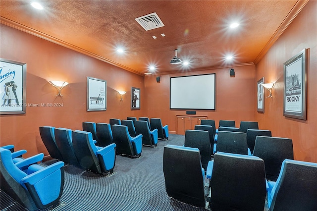 home theater with crown molding, carpet floors, and a textured ceiling