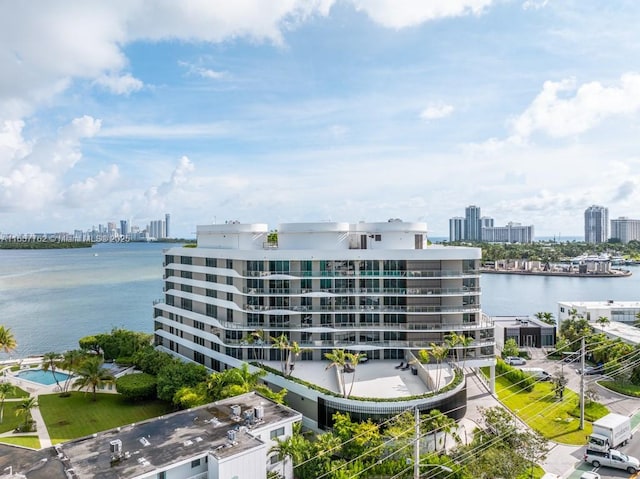 view of property with a city view and a water view