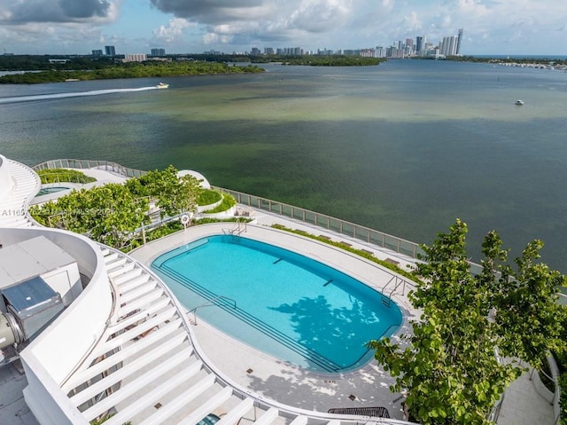 aerial view featuring a city view and a water view