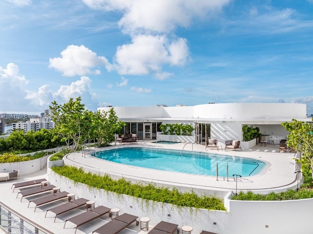 view of swimming pool featuring a patio area