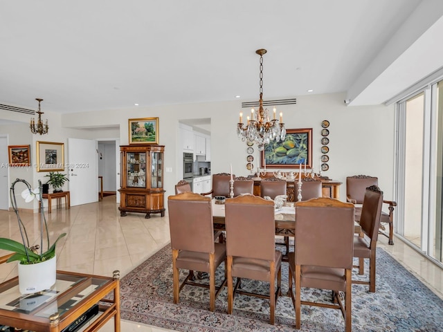 dining space featuring light tile patterned floors and a notable chandelier