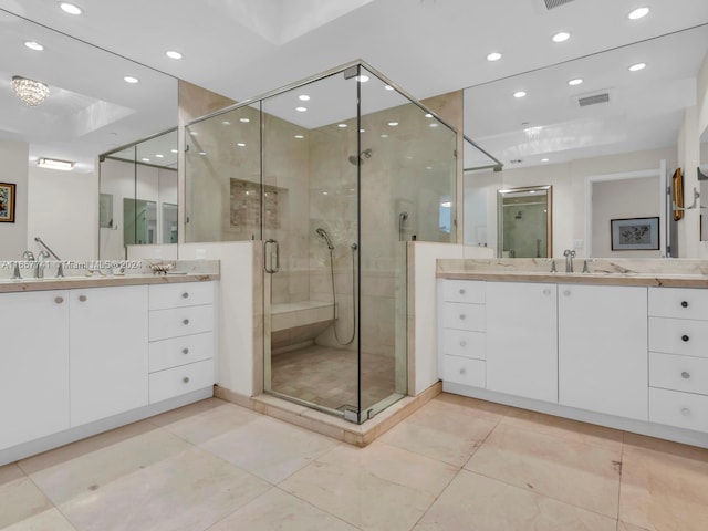 bathroom featuring walk in shower, vanity, and tile patterned flooring