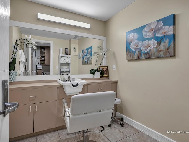 bathroom with tile patterned flooring and vanity