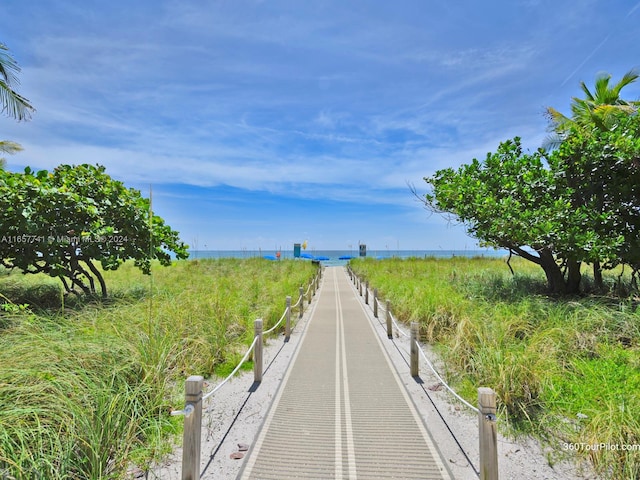 surrounding community with a water view