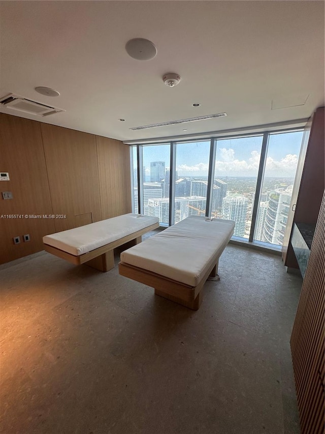 recreation room with wood walls