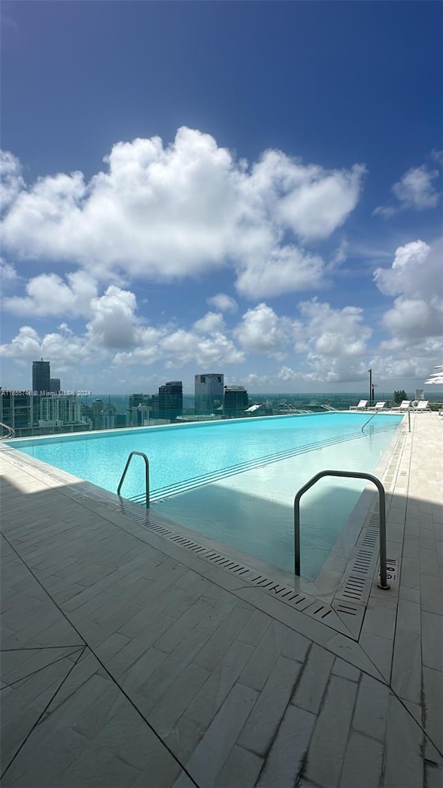 view of pool featuring a patio area