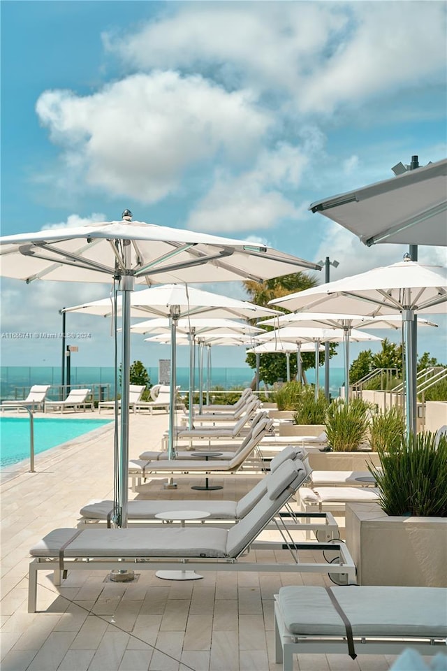 view of patio / terrace featuring a community pool