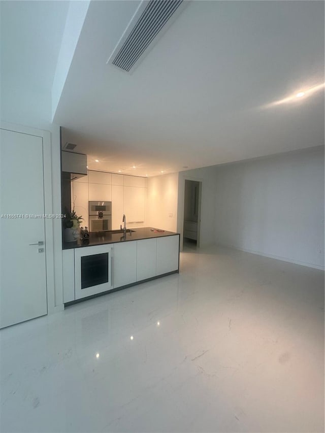 kitchen featuring oven and sink