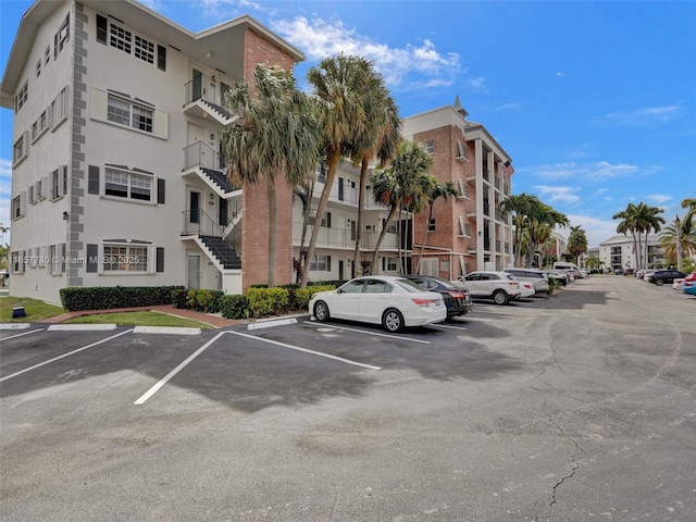 view of property featuring uncovered parking