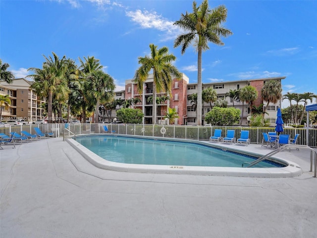 pool featuring a patio and fence