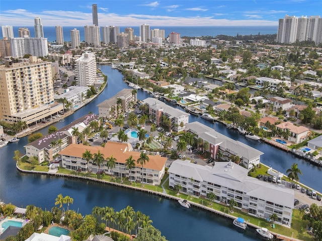 drone / aerial view with a view of city and a water view