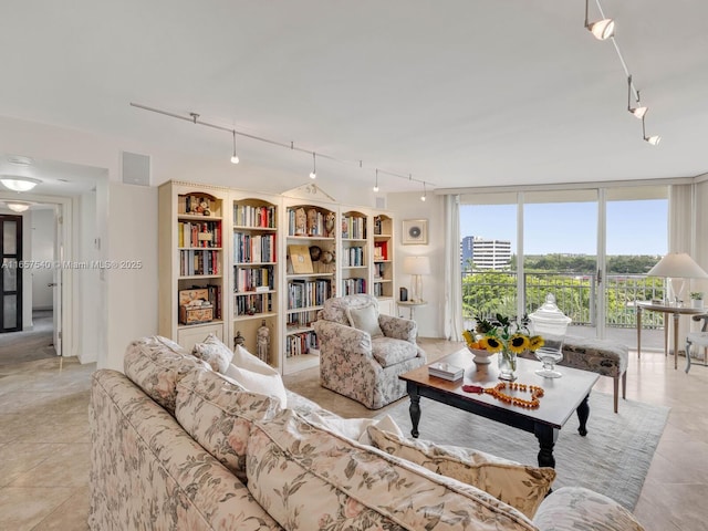 tiled living room featuring floor to ceiling windows