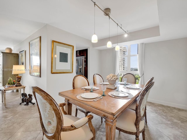 dining room featuring track lighting