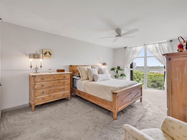 bedroom featuring ceiling fan and light colored carpet