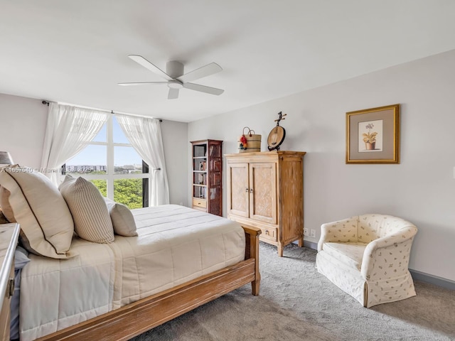 bedroom with ceiling fan and light carpet